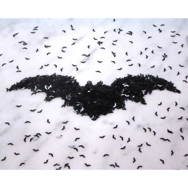 May include: A black bat shape made from small black bats on a white background.