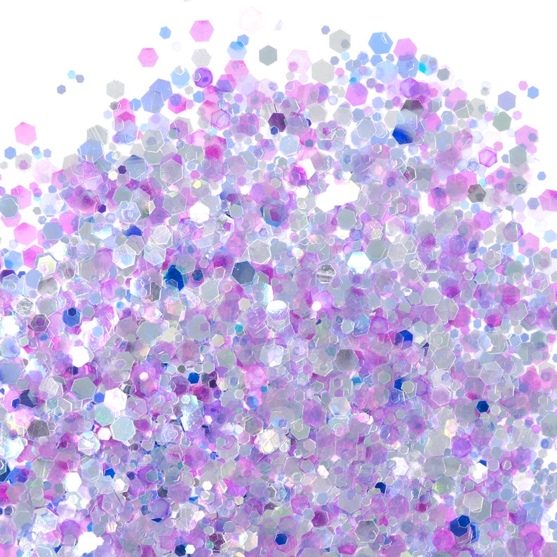 May include: A close-up of iridescent glitter in shades of purple, blue, and white. The glitter is scattered on a white background.