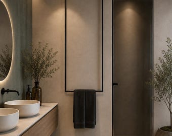 May include: A bathroom interior featuring a floating wooden vanity with two white vessel sinks, a round backlit mirror, a black metal towel rack holding a dark gray towel, a tall glass shower enclosure, and a potted plant on a woven floor mat.