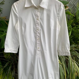 Chemise longue à boutons Prada