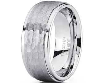 May include: A silver tungsten carbide ring with a hammered finish and a beveled edge. The ring is engraved with "TUNGSTEN CARBIDE".