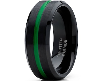 May include: A black tungsten carbide ring with a green stripe. The ring is engraved with the words "Tungsten Carbide".