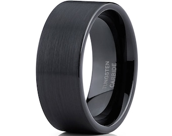 May include: A black tungsten carbide ring with a brushed finish. The ring is engraved with the words "Tungsten Carbide".
