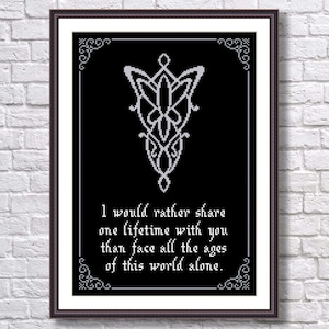 May include: Black and white cross-stitch pattern with a silver-colored symbol and the quote "I would rather share one lifetime with you than face all the ages of this world alone."