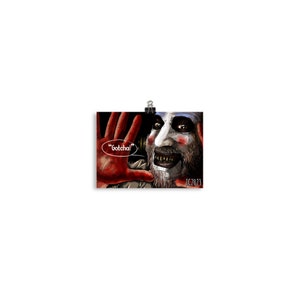 May include: A close-up of a man with a white and black clown makeup, wearing a dark shirt. He is smiling with his mouth open, showing his teeth. He has a beard and is holding his hands up in front of him. A speech bubble above his head says "Gotcha!" The image is signed "JC2023".