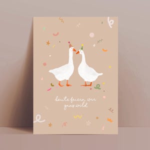 May include: A greeting card featuring two white geese wearing party hats, set against a beige background with confetti and the text "heute feiern wir ganz wild". The geese have orange feet and beaks. The card is rectangular.