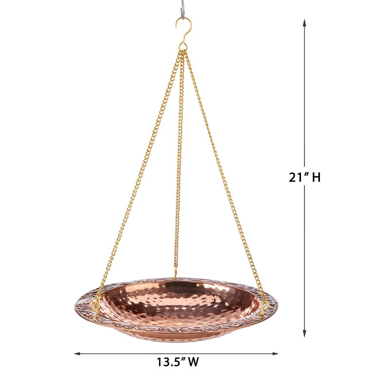 May include: A copper hanging bird bath with a hammered finish and a 13.5 inch diameter. The bath is suspended from a chain and measures 21 inches in height.