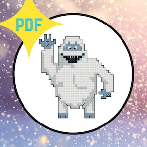 May include: A white snowman with a blue face and black eyes and mouth, waving with one arm raised. The snowman is pixelated, resembling a cross-stitch pattern.