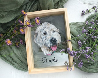 May include: A framed painting of a white dog with a pink tongue sticking out. The dog's name is "Purple" written in black cursive below the painting.