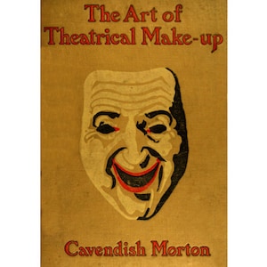 Op de afbeelding: De omslag van een boek getiteld "The Art of Theatrical Make-up" door Cavendish Morton. De omslag toont een zwart-witte illustratie van een glimlachend gezicht met rode lippen.