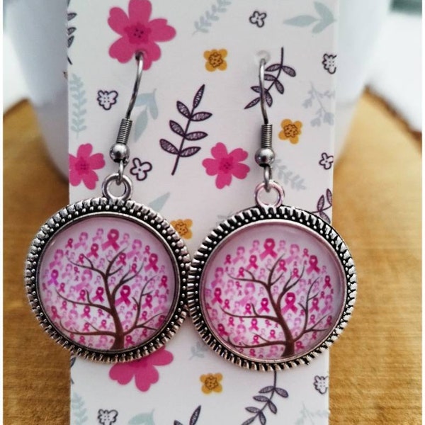 Octobre rose  boucle d'oreille pendantes image arbre de rubans rose contre la ligue du cancer du sein .