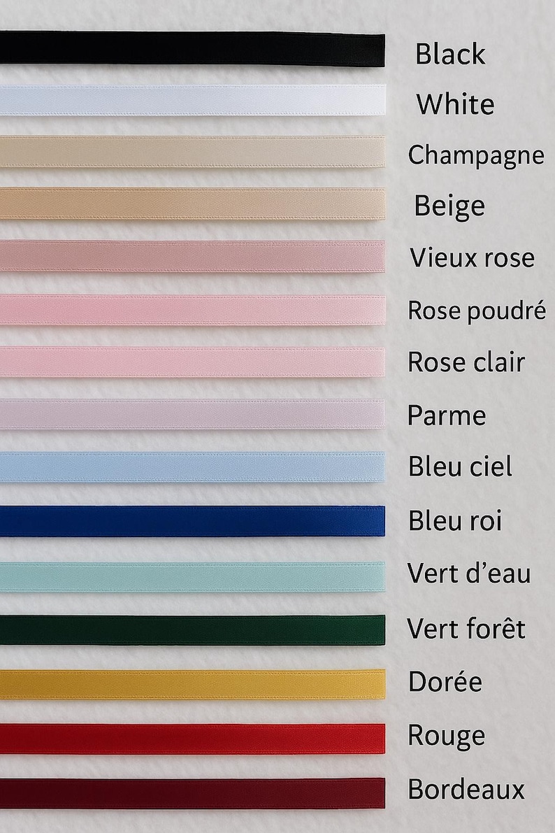 May include: A selection of colorful ribbons in various shades, including black, white, beige, pink, blue, green, gold, red, and burgundy. Each ribbon is labeled with its color name in a vertical list.