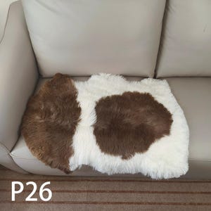 May include: A white ceramic mug with a black handle and the text "But First, Coffee" in a handwritten style. The mug is on a white surface. The mug is 10 cm tall.