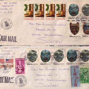 May include: Two envelopes with stamps from the United States Postal Service. The envelopes are addressed to Mr. and Mrs. Russell Olofson, Bengts Vag 13, 254 84 Helsingborg, Sweden. The stamps feature images of Native American art and a scene with a cabin in the woods. The envelopes are postmarked August 1981 and September 1981.