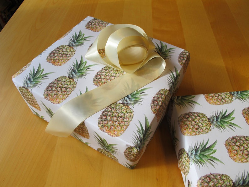 Luscious pineapples on a cream background make this giftwrap extra special.