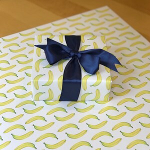 Banana paper wrapped gift on sheet of banana giftwrap