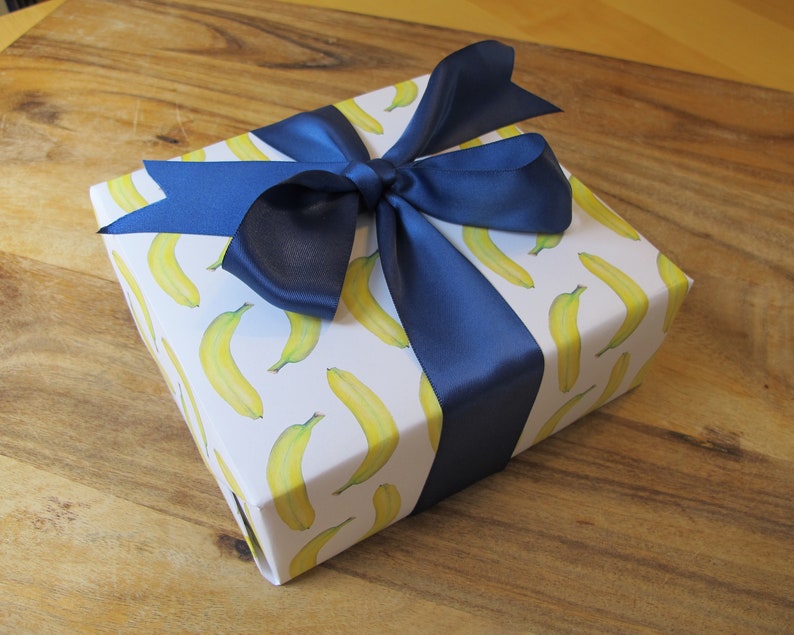 gorgeous banana giftwrap with blue ribbon
