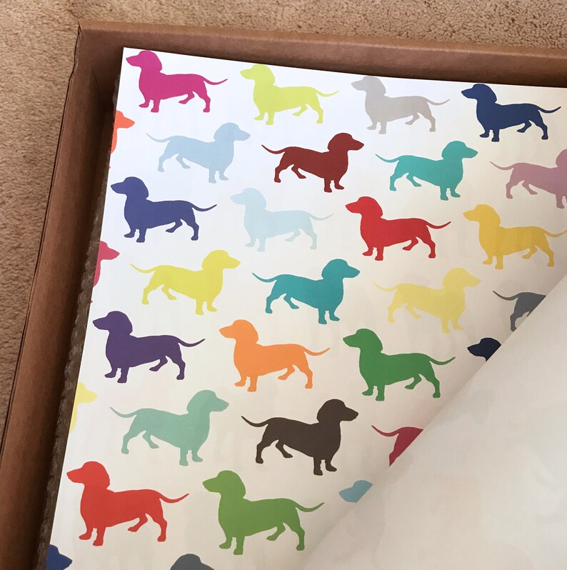 brightly-colored dachshunds make a whimsical pattern dancing upon a sheet of high-quality giftwrap.