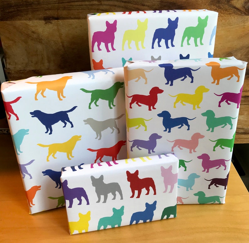 A selection of different breed dog wrapping papers (dachshund, lab, pug, and French bulldog).