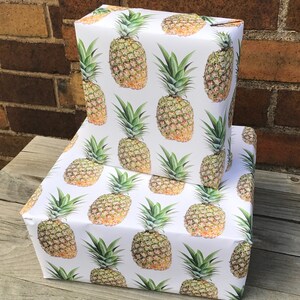Uniquely bold and realistic pineapples gives this tropical giftwrap a classy feel and crisp, papery texture.