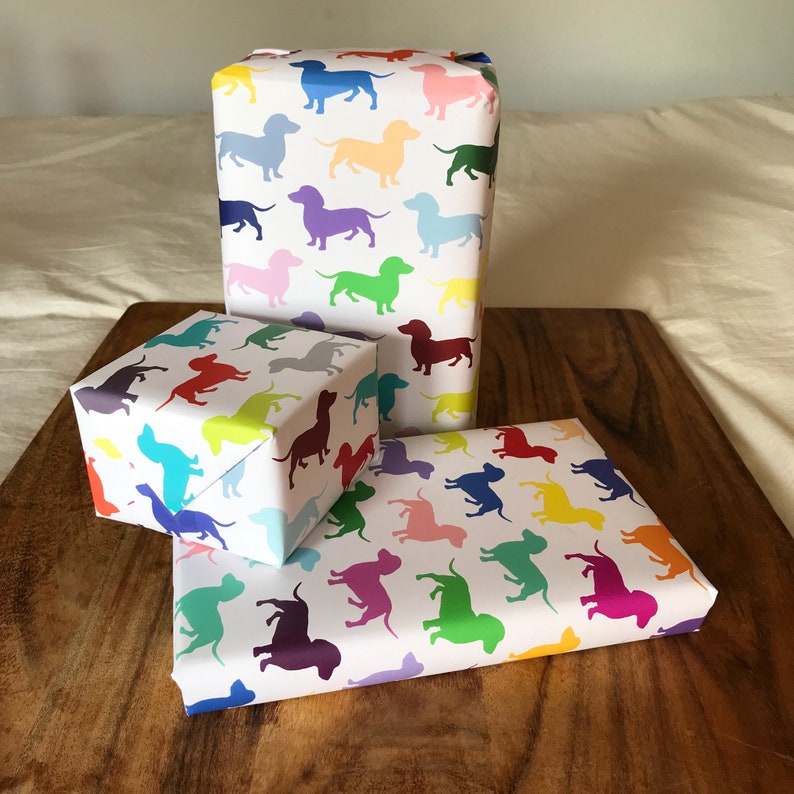 A election of different sized gifts wrapped in dachshund (sausage dog) giftwrap.
