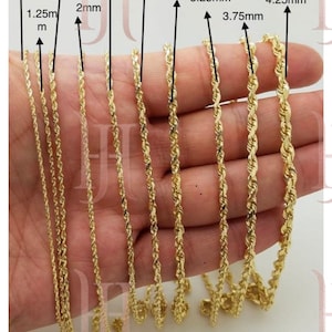 May include: A close-up of nine gold rope chains of varying thicknesses, ranging from 1 mm to 4.25 mm. The chains are laid out in a row on a hand, with the thickness of each chain labeled in millimeters.