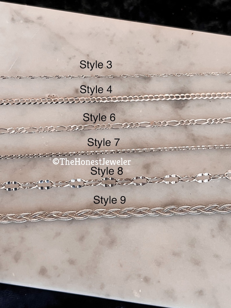 May include: Nine different styles of silver chains are displayed on a white marble surface. Each chain is labeled with a number from 3 to 9. The Honest Jeweler is credited in the image.