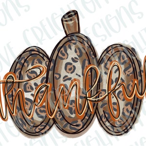 May include: A brown, orange, and black leopard print pumpkin with the word "thankful" written in a cursive font.