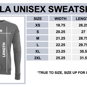 Peut inclure: Un sweat-shirt unisexe gris de la marque Bella, accompagn&eacute; d'un tableau des tailles. Le tableau indique les mesures de largeur, de longueur et de longueur des manches en centim&egrave;tres, pour les tailles XS &agrave; 2XL.