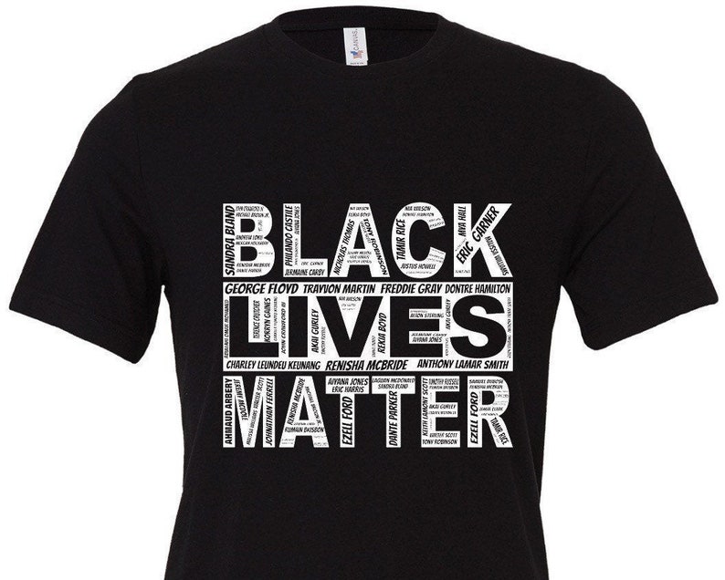 May include: Black Lives Matter t-shirt with a white graphic design featuring the words "Black Lives Matter" in large letters. The graphic also includes the names of many people who have been killed by police brutality.