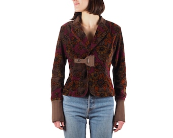 May include: A brown velvet blazer with a floral print and a brown buckle closure. The blazer has long sleeves and a fitted silhouette.