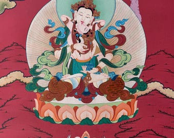 May include: A vibrant painting of a deity in a seated pose, adorned with a crown and jewelry. The figure is embraced by another figure, both set against a red background with mountain-like formations. The artwork features a halo and lotus flower base.