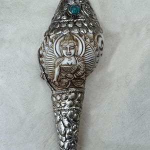 Hand-carved Conch Shell of Shakyamuni Buddha with German Silver Pattern. 100 % Handmade from Nepal