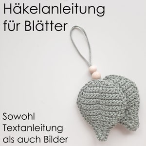 Peut inclure: Modèle de crochet pour feuilles avec instructions et images. Le modèle comprend deux feuilles avec une boucle et des perles en bois pour la suspension.