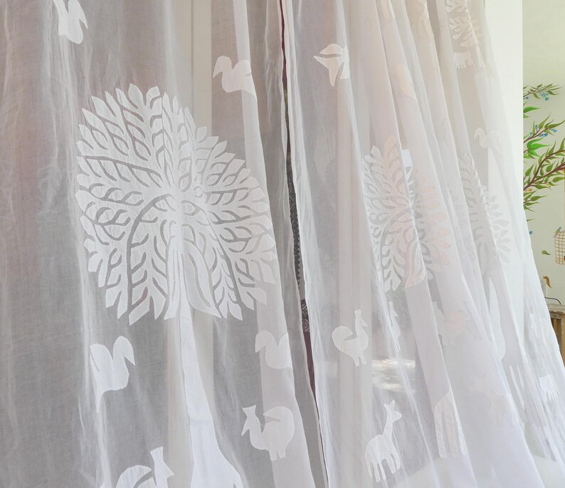 COTTON AND ORGANDI white with cutout and applique of a tree of life pattern