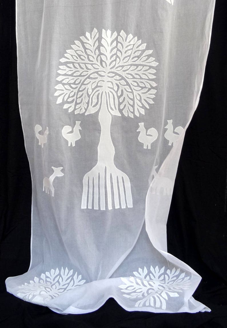 COTTON AND ORGANDI white with cutout and applique of a tree of life pattern
