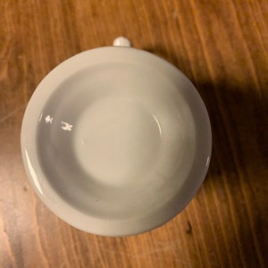 May include: White ceramic mug with a smooth, rounded interior. The mug is empty and appears to be new.