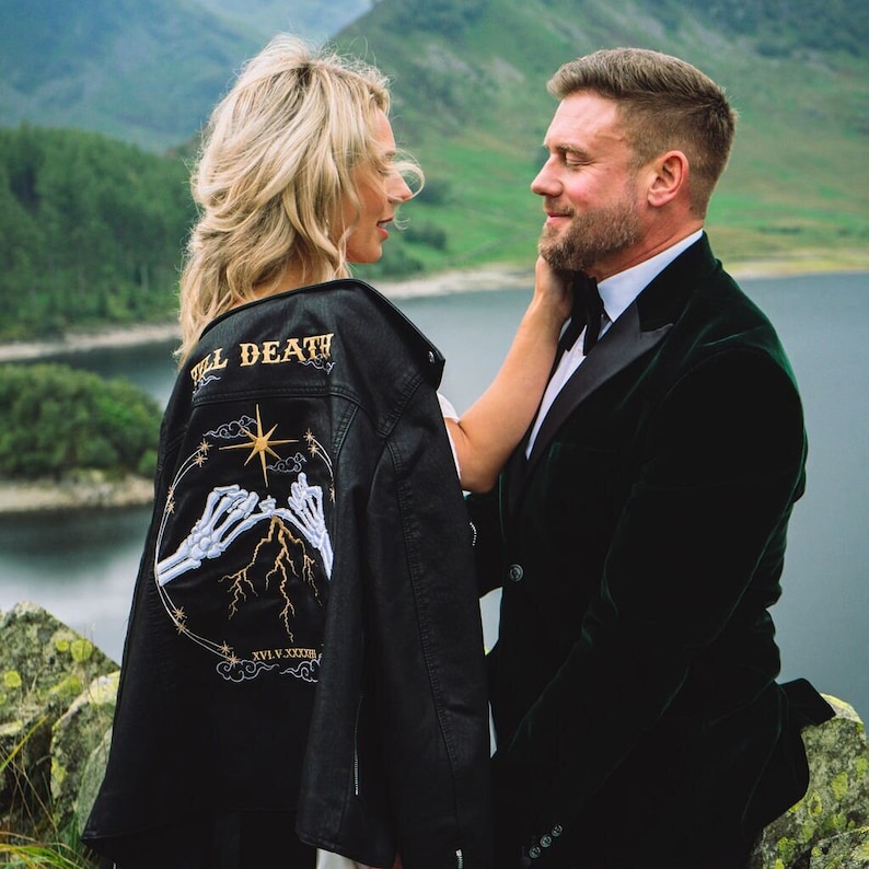 Black Bride Leather Jacket: Make a bold statement on your special day with this custom bride jacket, a stunning bridal cover-up adorned with a unique and intricate embroidery design inspired by a skeleton couple