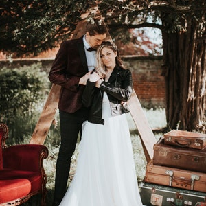 Black leather jacket with 'We Can Be Heroes' David Bowie-inspired embroidery for brides
