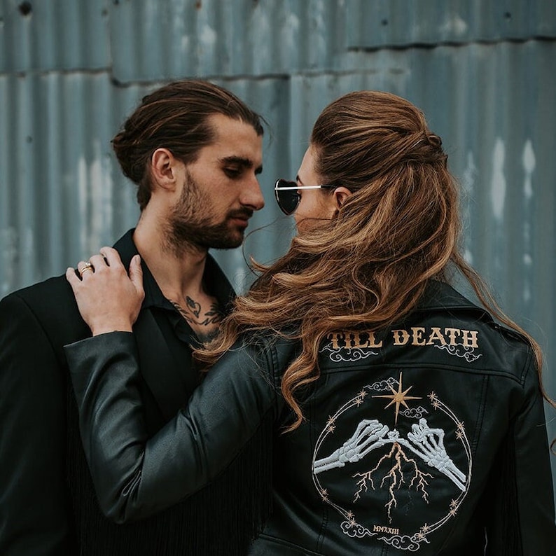 Ultra cool bride wearing a western inspired leather jacket on her wedding day