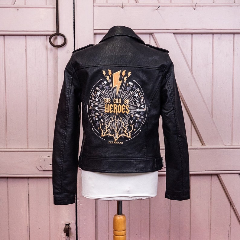 Black biker jacket adorned with celestial bride embroidery, perfect for weddings