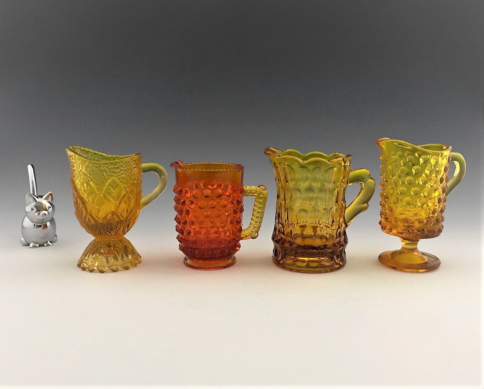 Collection of 4 Small Glass Creamers Individual Cream Pitchers