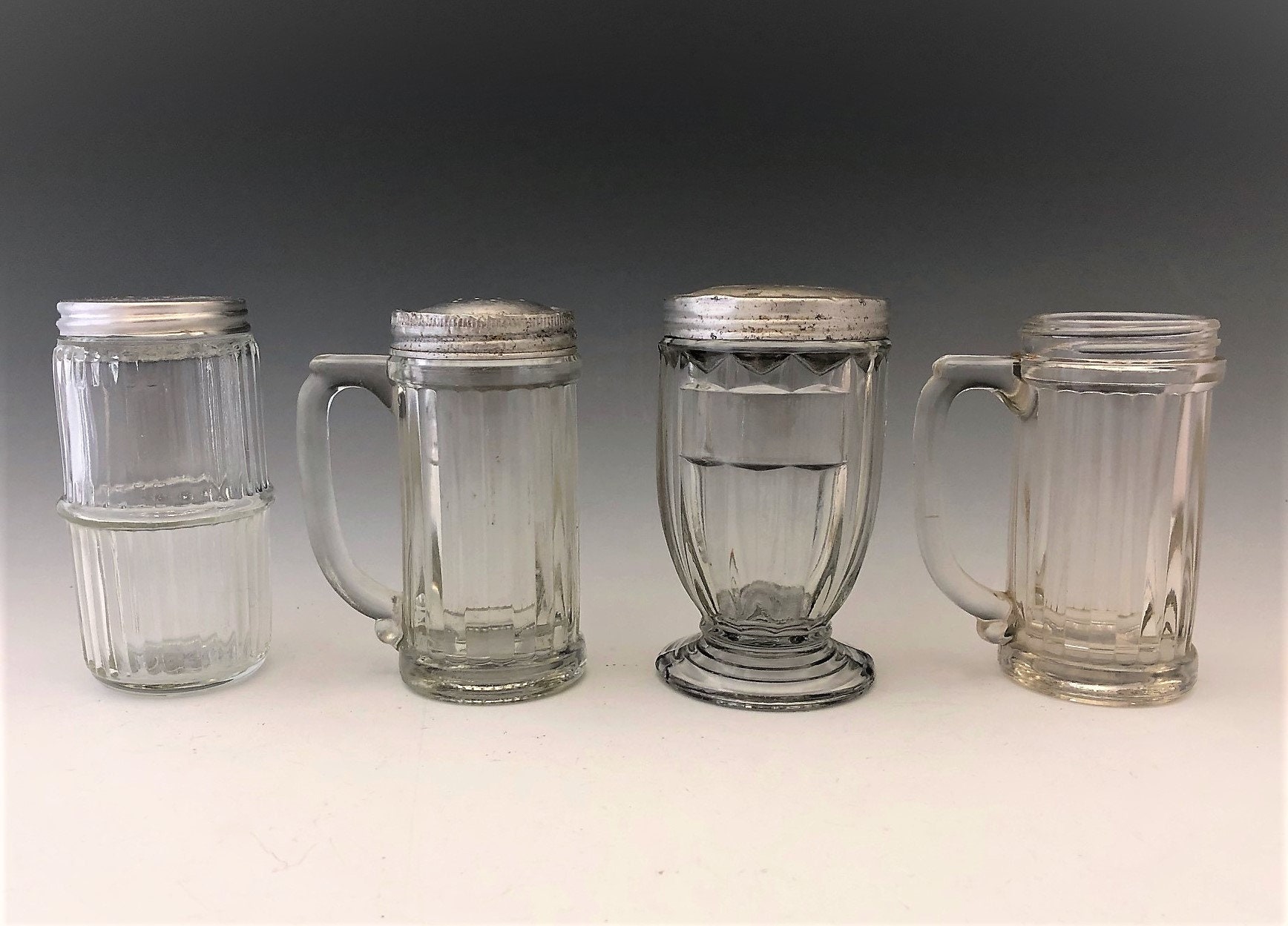 Collection of 4 Vintage Shakers Tin Lid Shakers Sugar Shakers