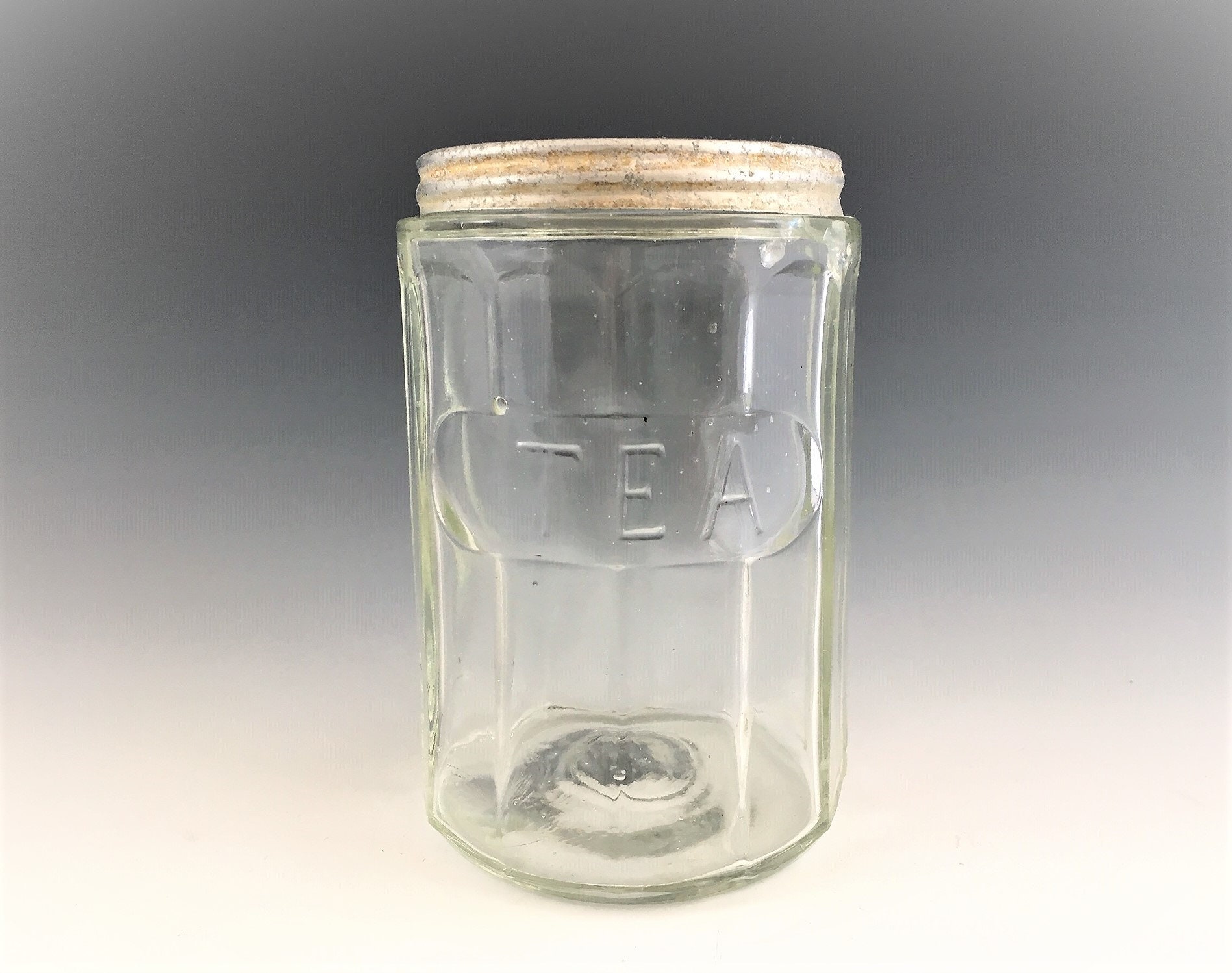 Vintage Indiana Glass Embossed TEA Jar With Tin Lid Circa 191030