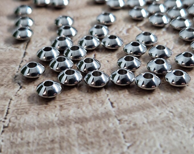 Stainless steel disc beads 6x3mm Silver