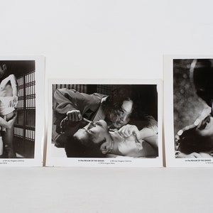May include: Three black and white photographs of scenes from the film "In the Realm of the Senses".