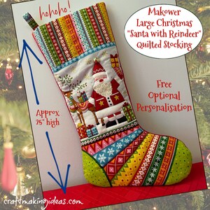 May include: A large, quilted Christmas stocking with a Santa and reindeer design, approximately 63.5 cm high. The stocking features a patchwork design with geometric patterns and the text "hohoho!". The text "Makower Large Christmas 'Santa with Reindeer' Quilted Stocking" is also visible.