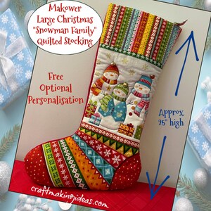 May include: A large, quilted Christmas stocking with a snowman family design. The stocking is approximately 63.5 cm high and features colorful patterns and the text "Makower Large Christmas 'Snowman Family' Quilted Stocking".