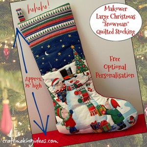 May include: A large, quilted Christmas stocking with a snowman design. The stocking is approximately 63.5 cm high and features a blue night sky with stars, a snowman, children, and Christmas trees. The top has a patterned border with the text "hohoho!"