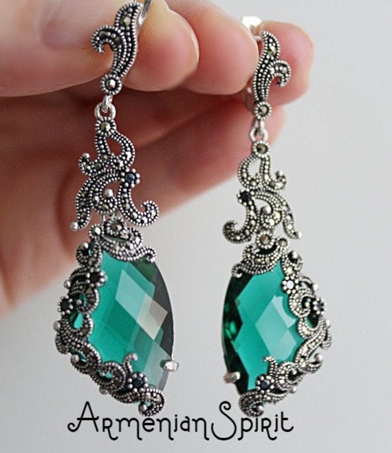 black dress with emerald green accessories